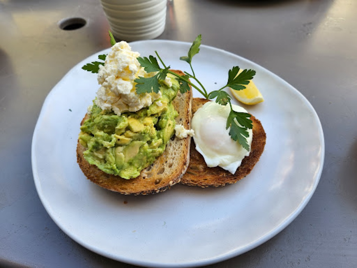 Smashed avocado and poached eggs on toast