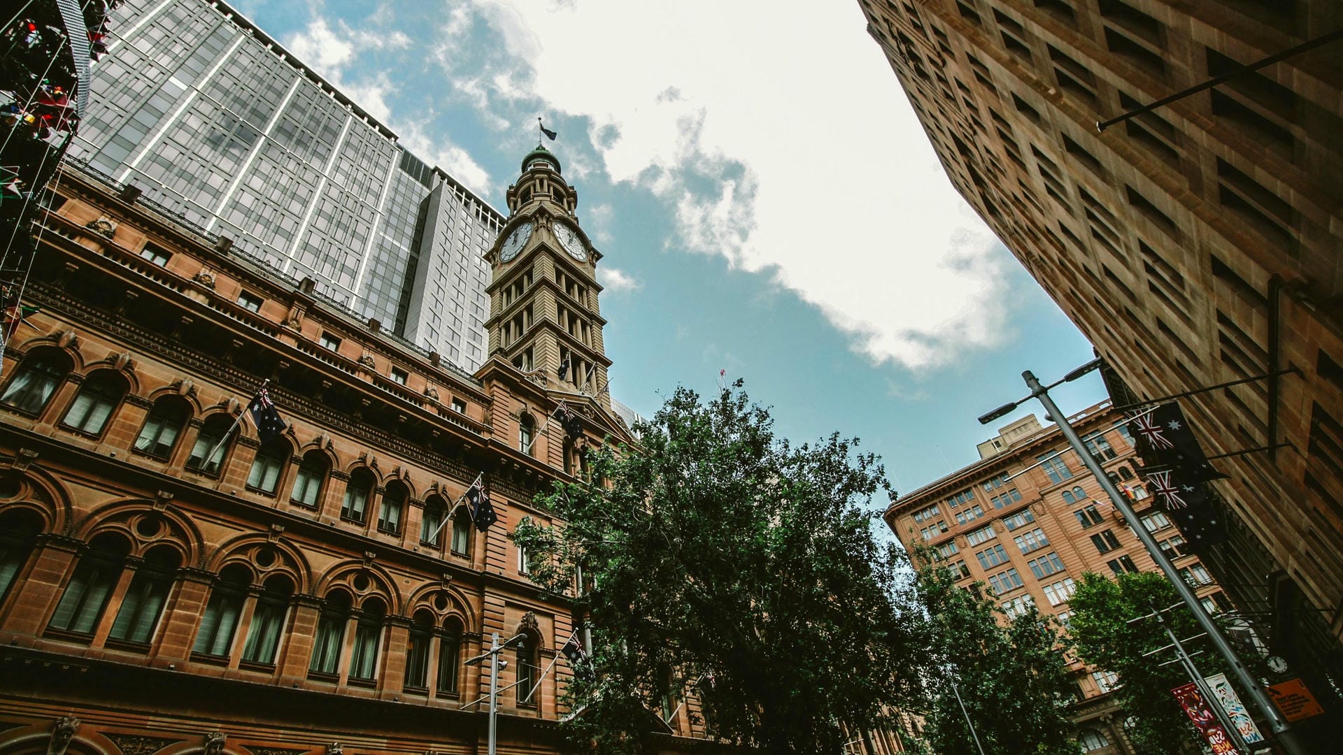 Looking up at some buildings and a clocktower in Sydney, New South Wales